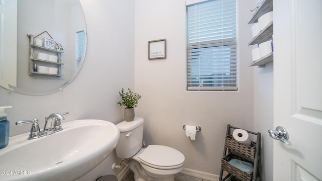 bathroom featuring sink and toilet