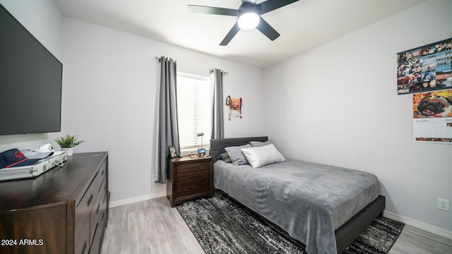 bedroom featuring ceiling fan and light hardwood / wood-style flooring