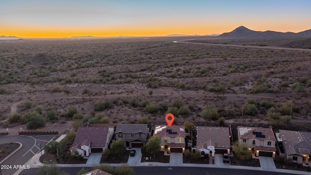 aerial view at dusk with a mountain view