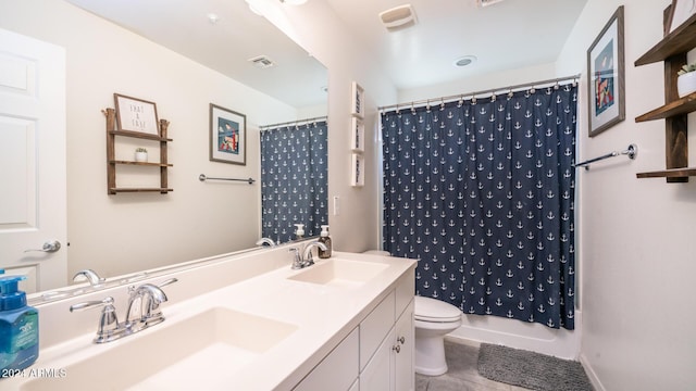 full bathroom featuring tile patterned floors, vanity, toilet, and shower / bath combination with curtain