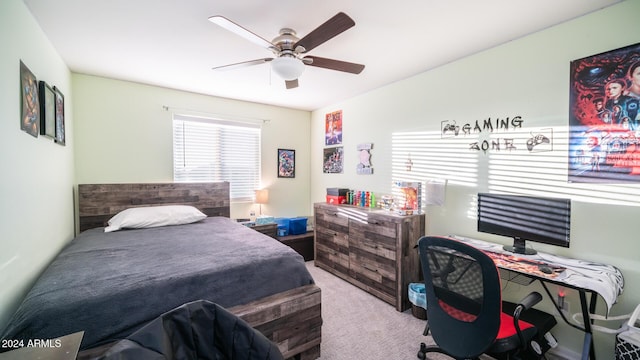 bedroom with ceiling fan and light carpet