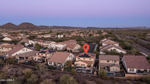 birds eye view of property featuring a mountain view