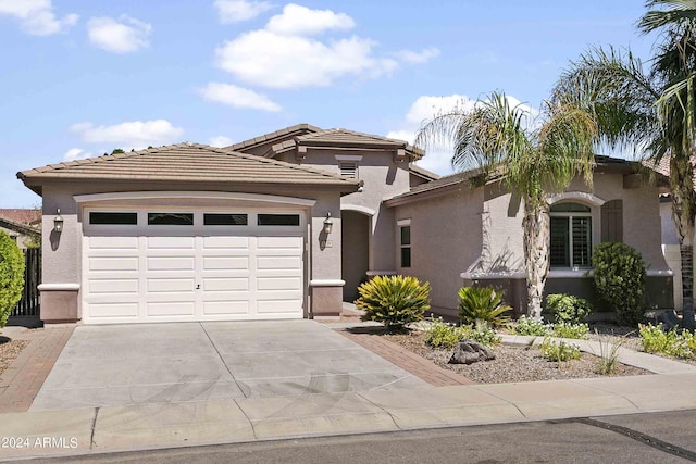 2736 E Sourwood Dr, Gilbert, AZ 85298 - view of front of home with driveway, a garage, stucco siding, and a tiled roof