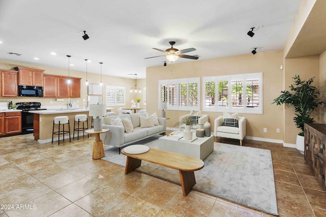 2736 E Sourwood Dr, Gilbert, AZ 85298 - living area featuring a ceiling fan, baseboards, and recessed lighting