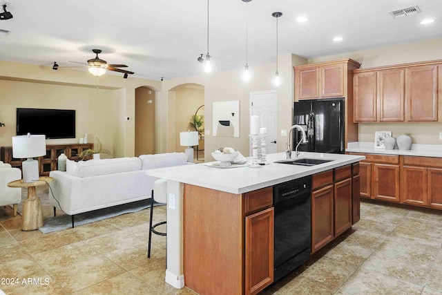 2736 E Sourwood Dr, Gilbert, AZ 85298 - kitchen featuring black appliances, a sink, open floor plan, light countertops, and recessed lighting