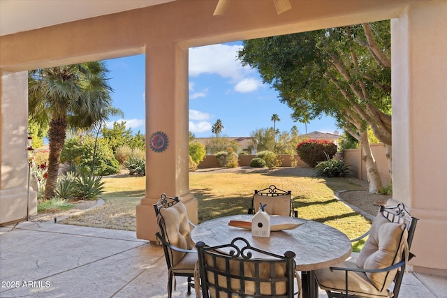 view of patio featuring ceiling fan