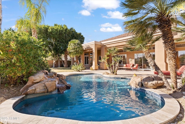 view of pool featuring a patio