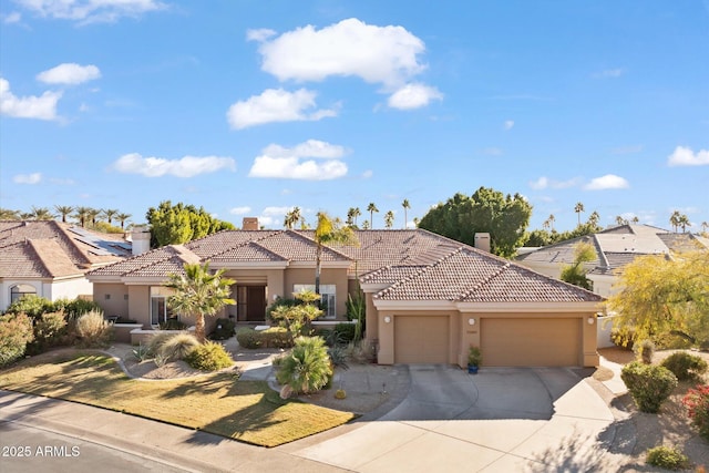 mediterranean / spanish-style home featuring a garage