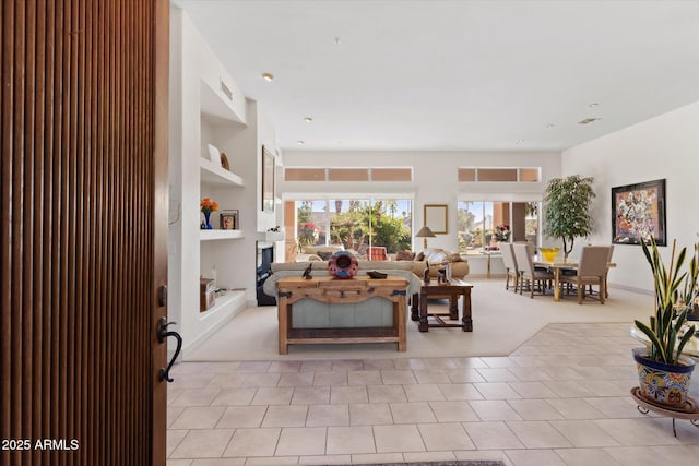 carpeted living room with built in features