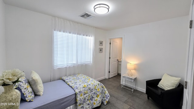 3128 E Desert Cove Ave, Phoenix, AZ 85028 - bedroom with baseboards and dark tile patterned flooring