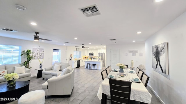 3128 E Desert Cove Ave, Phoenix, AZ 85028 - living room featuring a ceiling fan, plenty of natural light, and recessed lighting