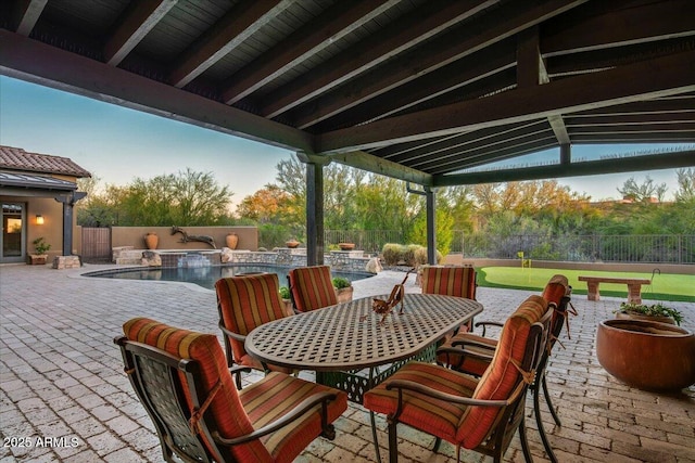 view of patio / terrace with a fenced in pool, a fenced backyard, and outdoor dining space