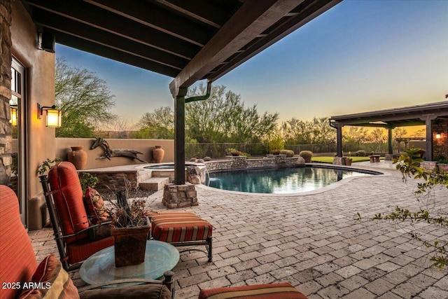 view of swimming pool with a patio area, a fenced in pool, an in ground hot tub, and a fenced backyard