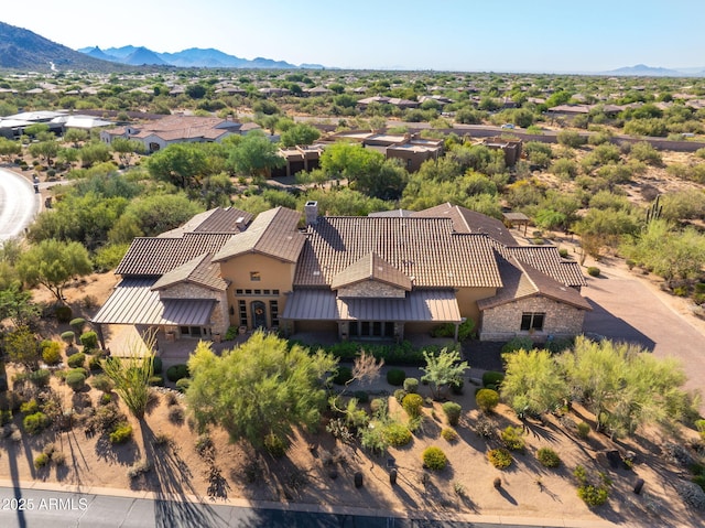 birds eye view of property with a mountain view