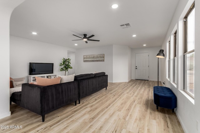 10625 E Bramble Ave, Mesa, AZ 85208 - living room with light wood-style flooring, ceiling fan, recessed lighting, and baseboards