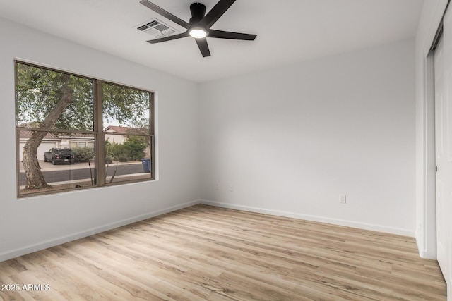 10625 E Bramble Ave, Mesa, AZ 85208 - spare room featuring a ceiling fan, wood finished floors, and baseboards