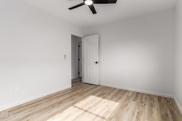 10625 E Bramble Ave, Mesa, AZ 85208 - unfurnished room featuring a ceiling fan, wood finished floors, and baseboards