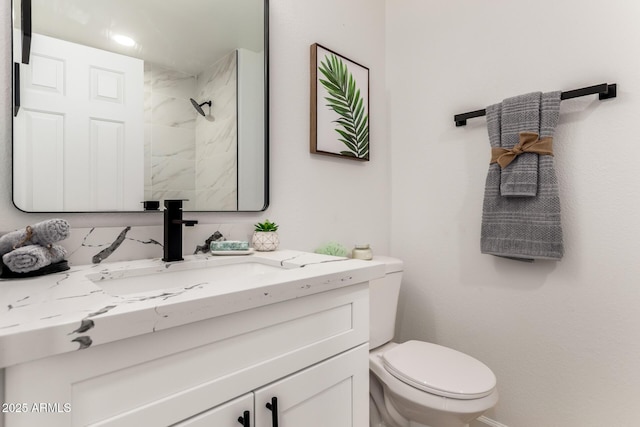 10625 E Bramble Ave, Mesa, AZ 85208 - bathroom with vanity, toilet, and a shower