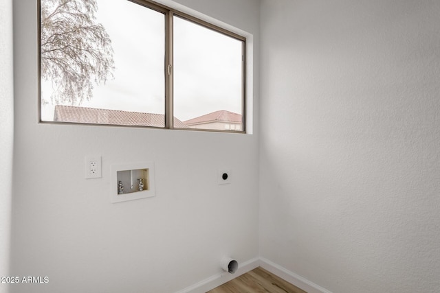 10625 E Bramble Ave, Mesa, AZ 85208 - washroom with hookup for an electric dryer, washer hookup, plenty of natural light, and baseboards