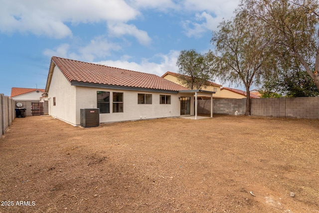 10625 E Bramble Ave, Mesa, AZ 85208 - rear view of house featuring a tile roof, central AC, a fenced backyard, stucco siding, and a patio area