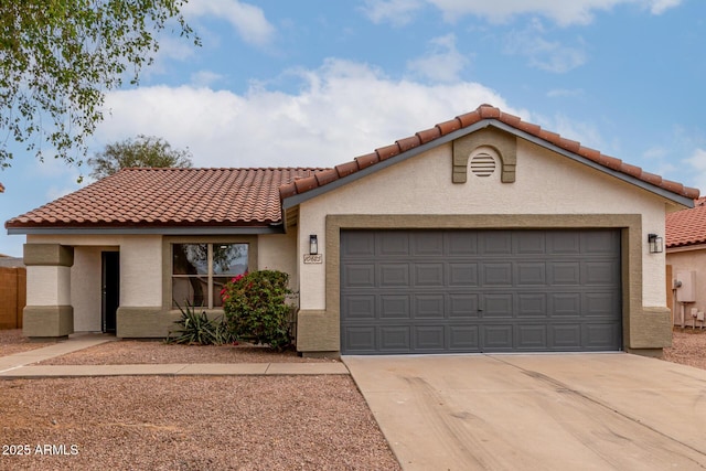 10625 E Bramble Ave, Mesa, AZ 85208 - mediterranean / spanish house featuring stucco siding, a tile roof, concrete driveway, and an attached garage