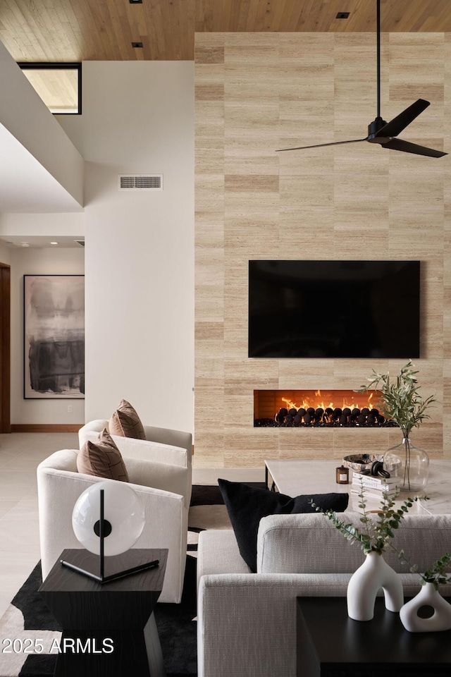 living room featuring wooden ceiling and ceiling fan