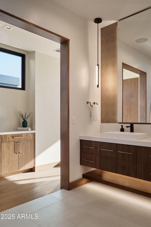 bathroom featuring tile patterned floors and vanity