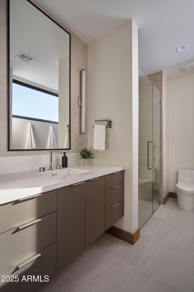 bathroom with walk in shower, tile patterned flooring, vanity, and toilet