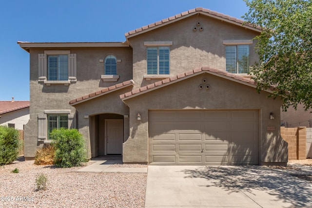 43670 W Mcclelland Ct, Maricopa, AZ 85138 - mediterranean / spanish-style house featuring an attached garage, stucco siding, and a tile roof