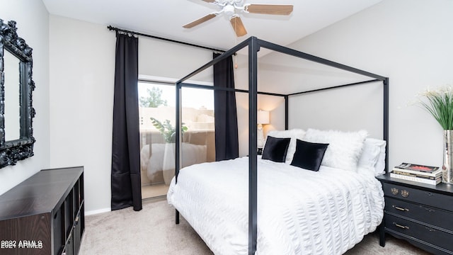 bedroom featuring ceiling fan and light colored carpet