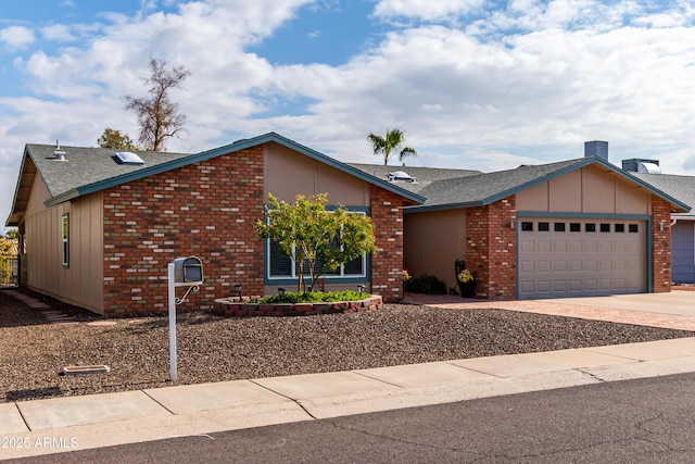 view of front of home featuring a garage, brick siding, driveway, and roof with shingles