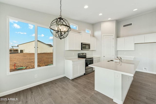 22343 S Manzanilla Rd, Buckeye, AZ 85326 - kitchen featuring stainless steel appliances, a chandelier, recessed lighting, white cabinetry, and dark wood-type flooring