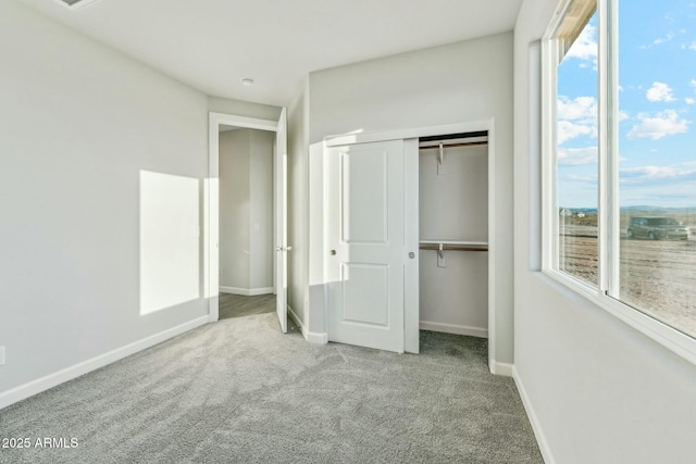 22343 S Manzanilla Rd, Buckeye, AZ 85326 - unfurnished bedroom with carpet floors and a closet