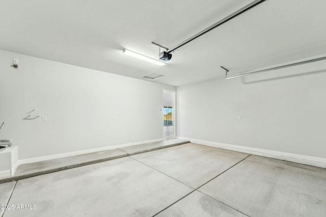 22343 S Manzanilla Rd, Buckeye, AZ 85326 - garage with a garage door opener and baseboards