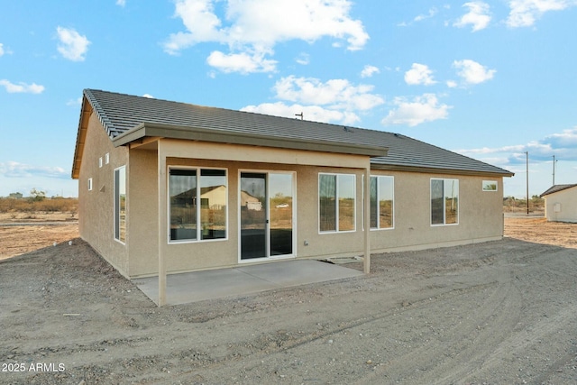 22343 S Manzanilla Rd, Buckeye, AZ 85326 - rear view of property featuring a patio, stucco siding, and a tiled roof
