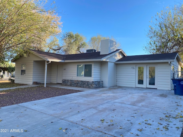 back of property featuring a patio and french doors