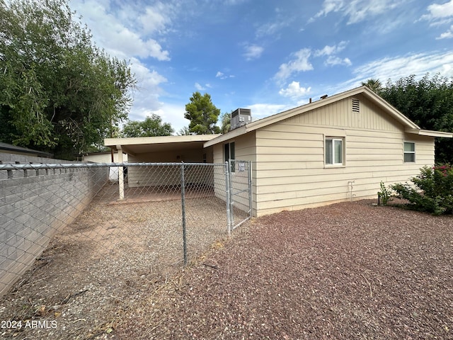 view of home's exterior featuring a carport