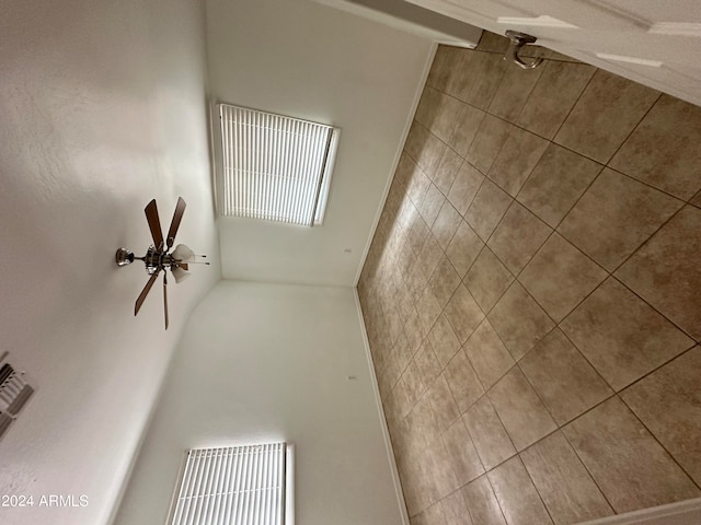 unfurnished room with ceiling fan