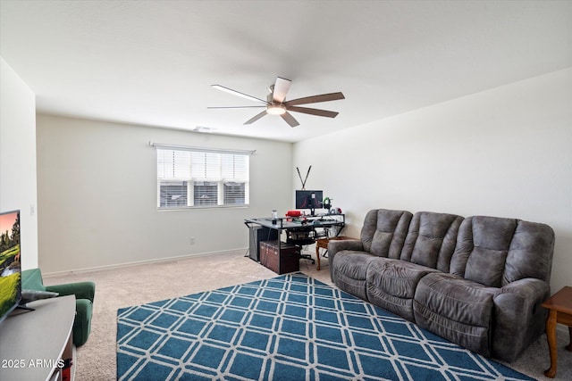 living room with ceiling fan and carpet flooring