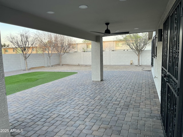 view of patio featuring a fenced backyard and a ceiling fan