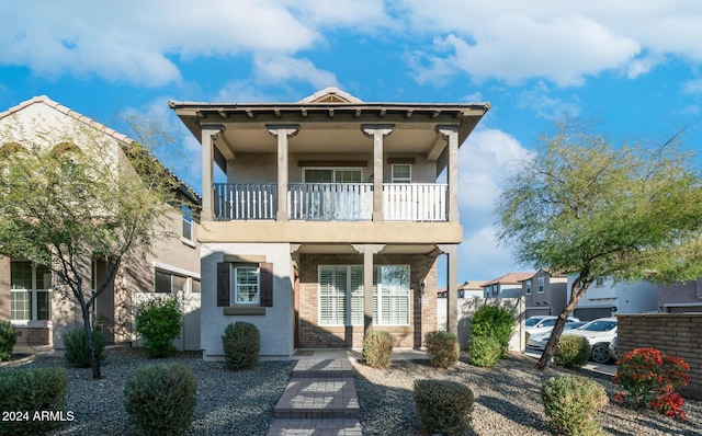 view of front of house with a balcony