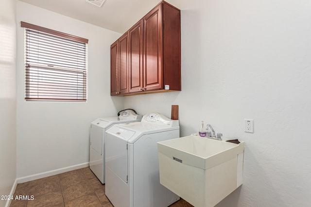 laundry area with washer and dryer, cabinets, sink, and tile patterned flooring