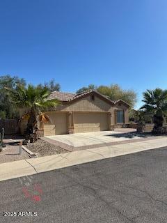 view of front of property featuring driveway and a garage