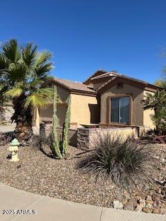 view of side of property with stucco siding