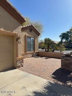 view of patio featuring a garage