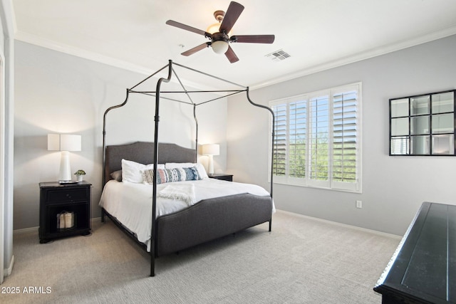 carpeted bedroom featuring crown molding, baseboards, and a ceiling fan