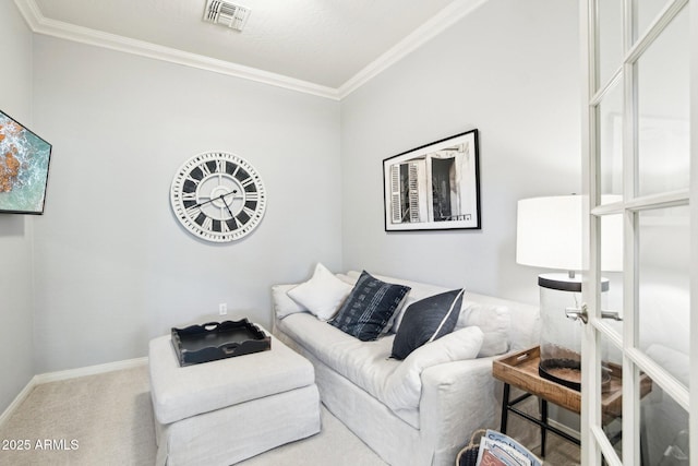 carpeted living area featuring crown molding and baseboards