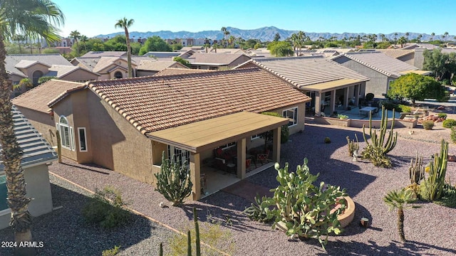 birds eye view of property with a mountain view