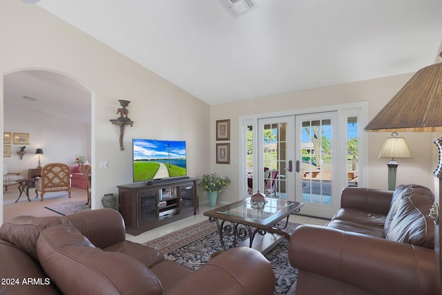 living room featuring french doors and lofted ceiling