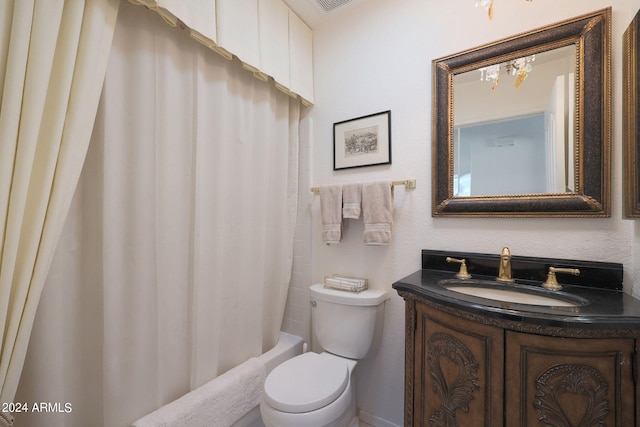 full bathroom featuring toilet, vanity, and shower / bath combination with curtain